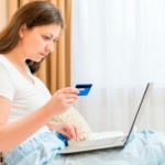 Woman shopping online with card: CannaSensation CBD or Hemp Blog